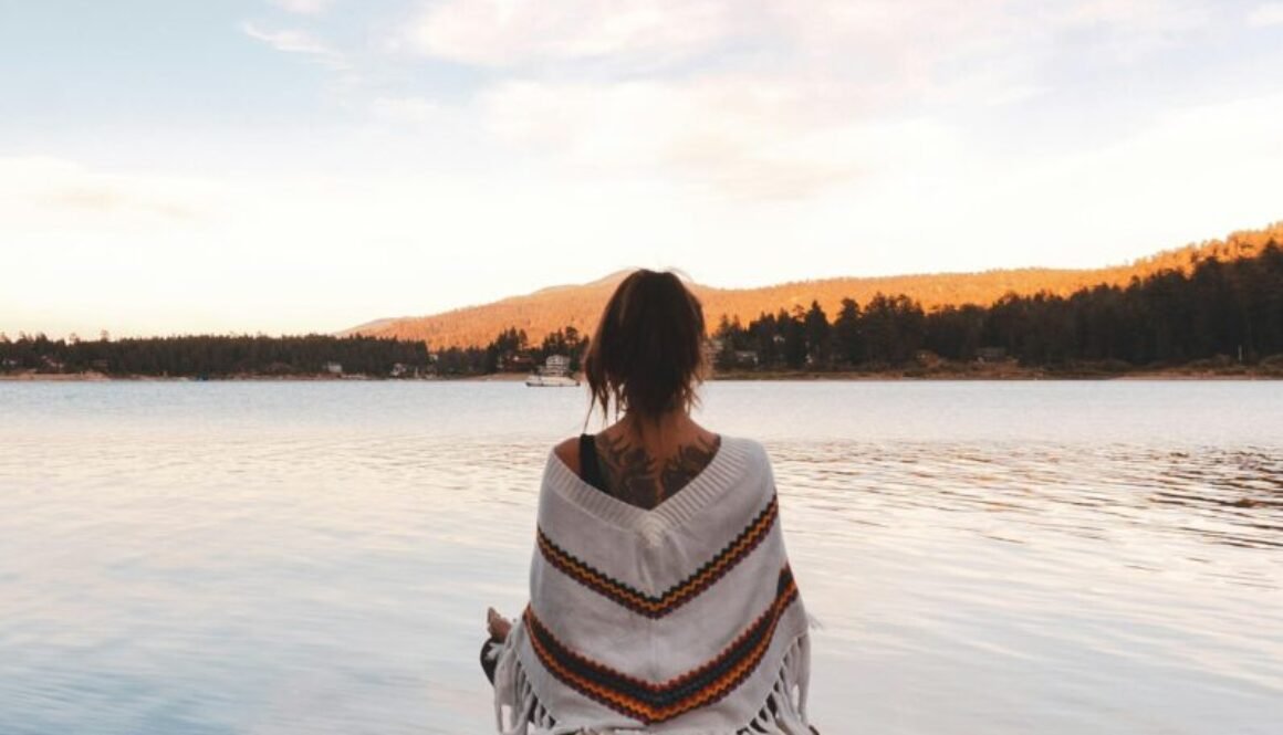 Calm lady looking into the serene ocean