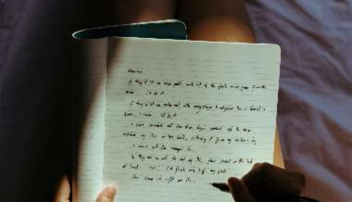 Person writing in a journal